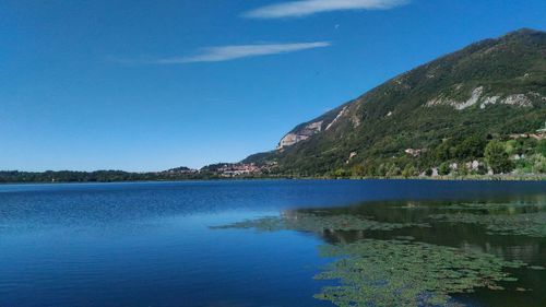 Scenic view of lake against blue sky