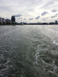 Scenic view of sea against cloudy sky