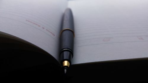 Close-up of pen on table