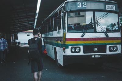 Rear view of people walking in city