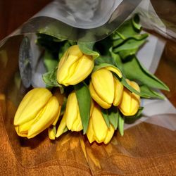Close-up of yellow flowers on table