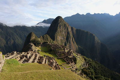 Scenic view of mountains against cloudy sky - machu picchu