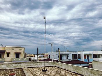 Houses against sky in city