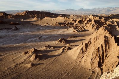 Scenic view of rock formations at desert against sky