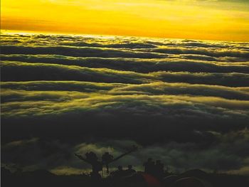 Low angle view of dramatic sky during sunset