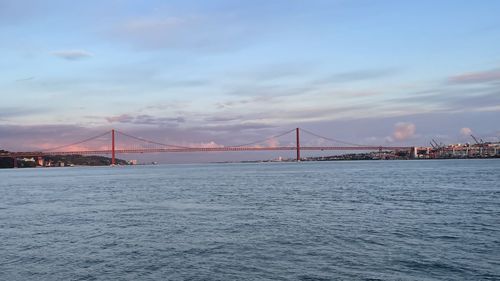 View of suspension bridge over sea