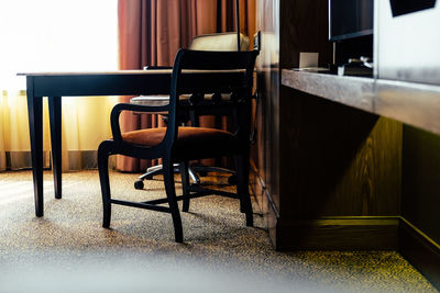 Empty chairs and table in restaurant