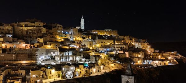 High angle view of illuminated buildings in city at night