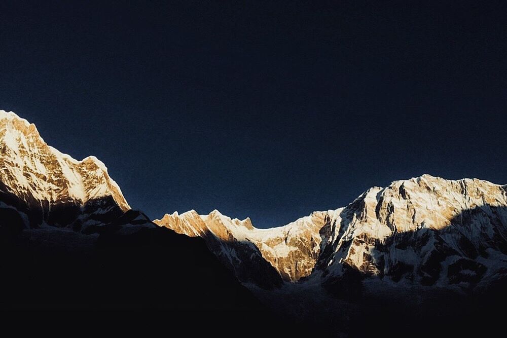 LOW ANGLE VIEW OF ROCK FORMATIONS AGAINST CLEAR SKY