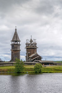 Tower by building against sky