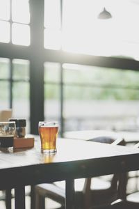 Close-up of beer glass on table