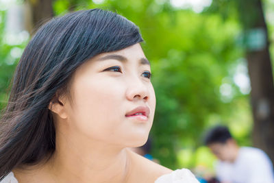 Portrait of a beautiful young woman outdoors