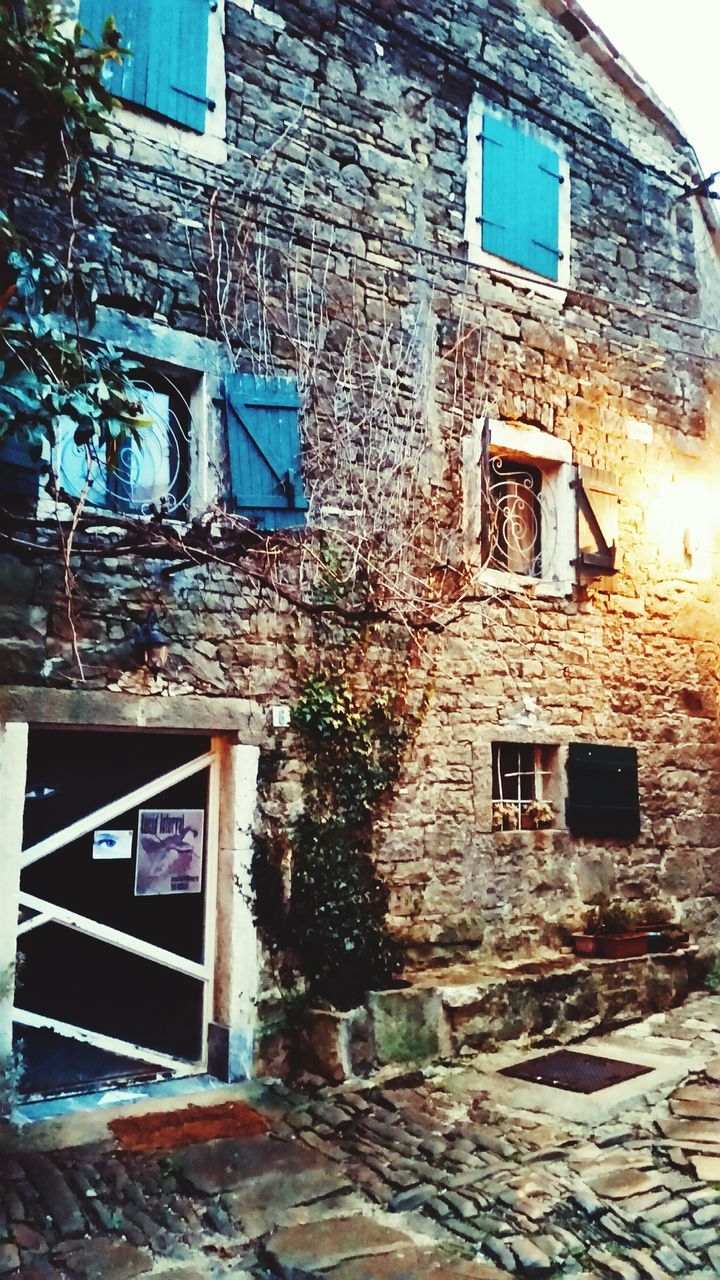 LOW ANGLE VIEW OF OLD HOUSE