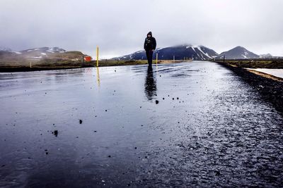 Man walking on road