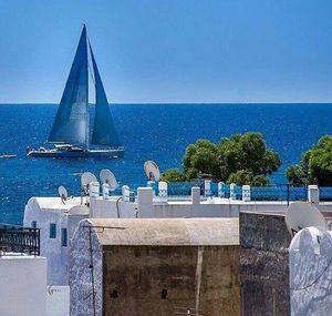 Scenic view of sea against blue sky