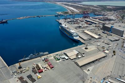 High angle view of city by sea and buildings cruise port