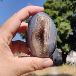 Cropped hand holding crystal ball