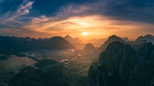 Scenic view of mountains against sky during sunset