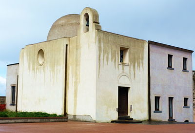 Exterior of historic building against clear sky