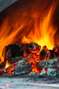 Red, orange and yellow flames from firewood in a oven