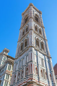 Low angle view of building against blue sky