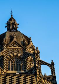 Low angle view of temple against blue sky