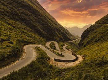 Scenic view of mountain road against sky