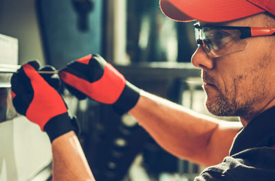 Side view of man using mobile phone