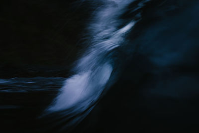 Darkness wave breaking with slow exposure