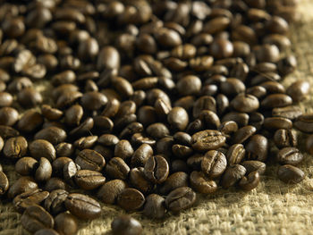 Close-up of coffee beans on jute