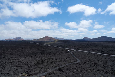 Scenic view of volcanic landscape against sky