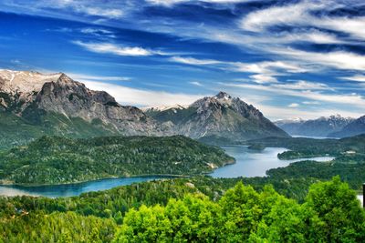 Scenic view of lake and mountains against sky