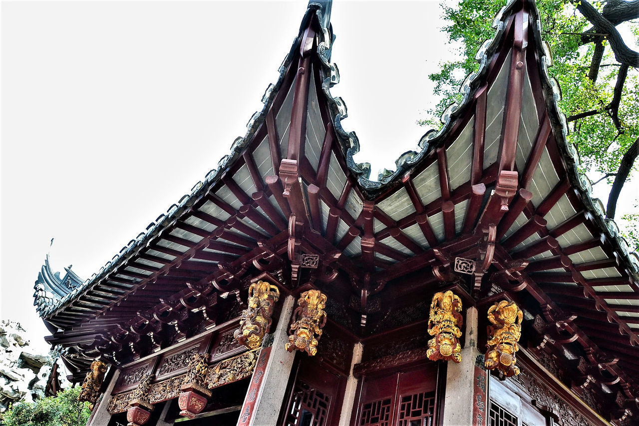 LOW ANGLE VIEW OF TEMPLE AGAINST BUILDING