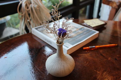 Close-up of flower vase on table