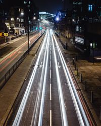 High angle view of light trails on road at night