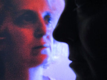 Close-up of child against sky at night