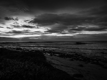 Scenic view of sea against cloudy sky