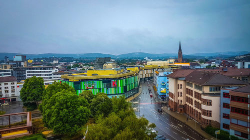 High angle view of buildings in city against sky