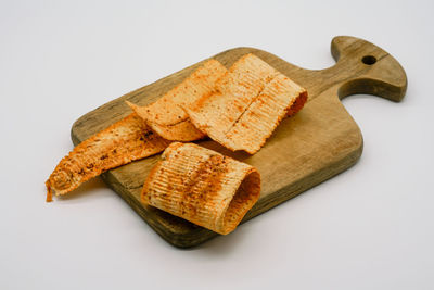 Close-up of cake against white background