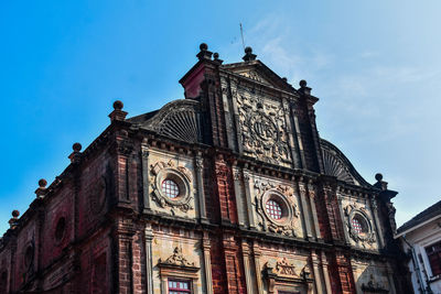 Basilica of bom jesus church in goa taken from lower angle with blue sky