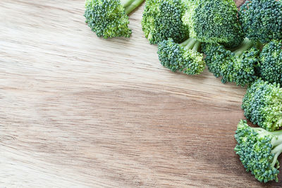 High angle view of broccolis on cutting board in kitchen