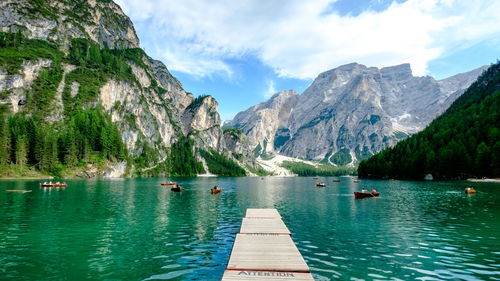 Scenic view of lake and mountains against sky