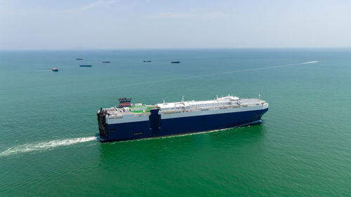 Boats in sea against sky