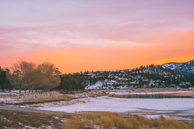 Scenic view of field against sky during winter