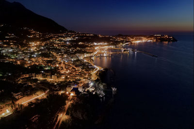 Aerial view of the port of casamicciola at night. ischia - italy