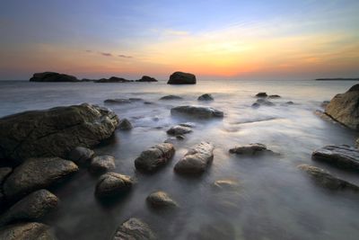 Scenic view of sea at sunset