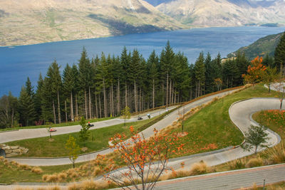 High angle view of road by trees and mountains
