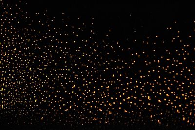 Close-up of illuminated lights at night