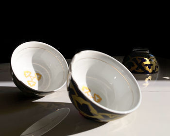 High angle view of breakfast on table against black background