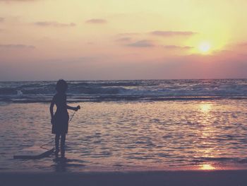 Scenic view of sea at sunset